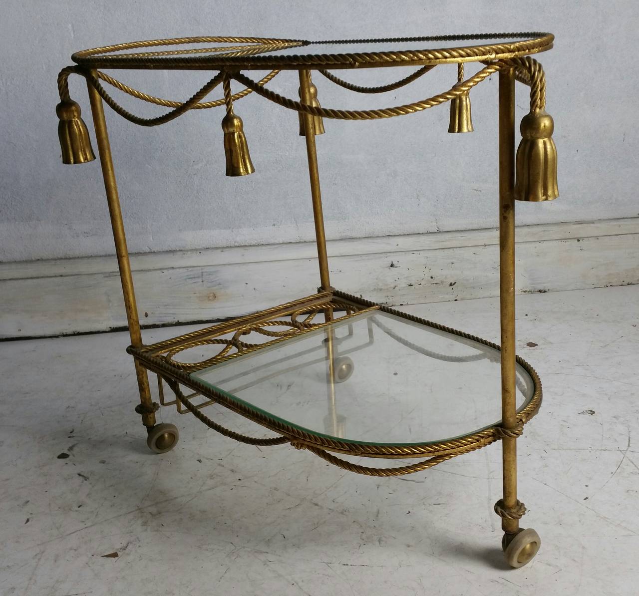 Italian Gilt Metal Rope and Tassel Bar Cart... Nice vintage patina..Fit seamlessly into any modernist,traditional environment..