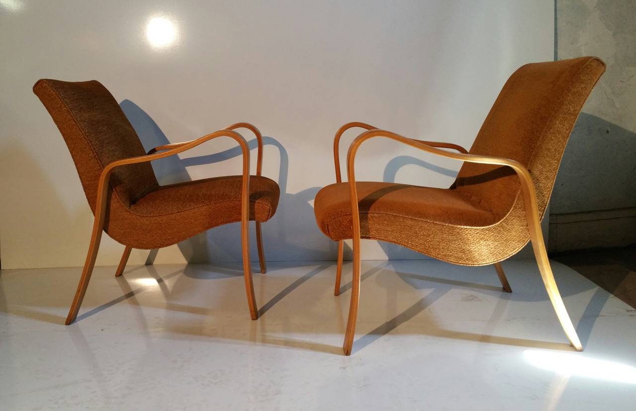 Classic pair of Mid-Century Modern lounge chairs. Manufactured by Thonet, Reminesent of the famed, Paimio armchair by Alvar Aalto. Extremely comfortable, retains original cut wool fabric, circa late 1940s.