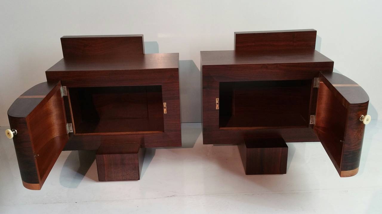Exquisite design, modernist, Cubist. Matched pair of tables or stands, French Art Deco, inlaid wood, rosewood construction. Retain original bakelite hand pulls.