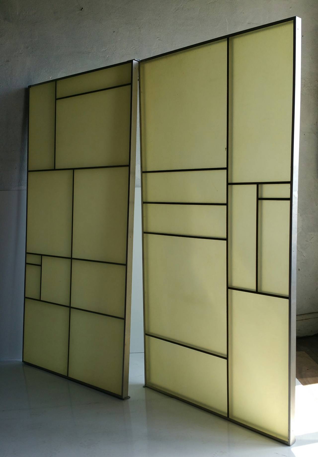 Very unusual aluminum and fiberglass panels, amazing Piet Mondrian design. Double sided. Retain aluminum mounting bracket affixed to top and bottom. Make a wonderful privacy screen, room divider, back lit décor.