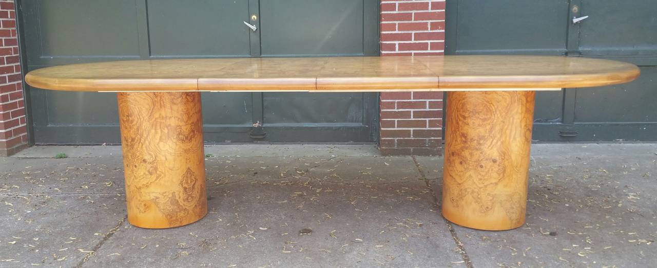 Beautiful Olivewood Dining table manufactured by Henredon,,Amazing olive veneer double pedistal cylinders hold a solid thick oval olivewood veneer top, Measures 72