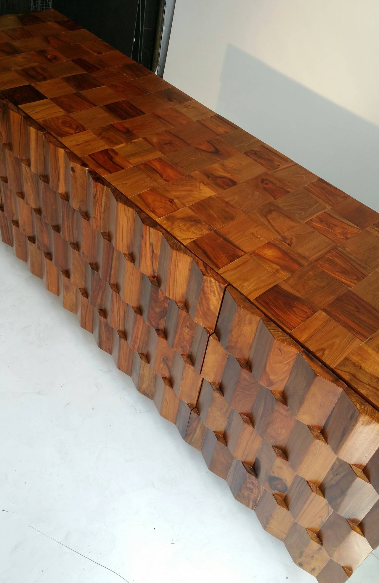 Wonderful Design One of a kind Custom designed and built,possibly exicuted by a student of Wendell Castle Brutalist cabinet/sideboard Carefully cut and attached triangular pieces of rosewood teak and walnut Also rosewood, teak and walnut patchwork