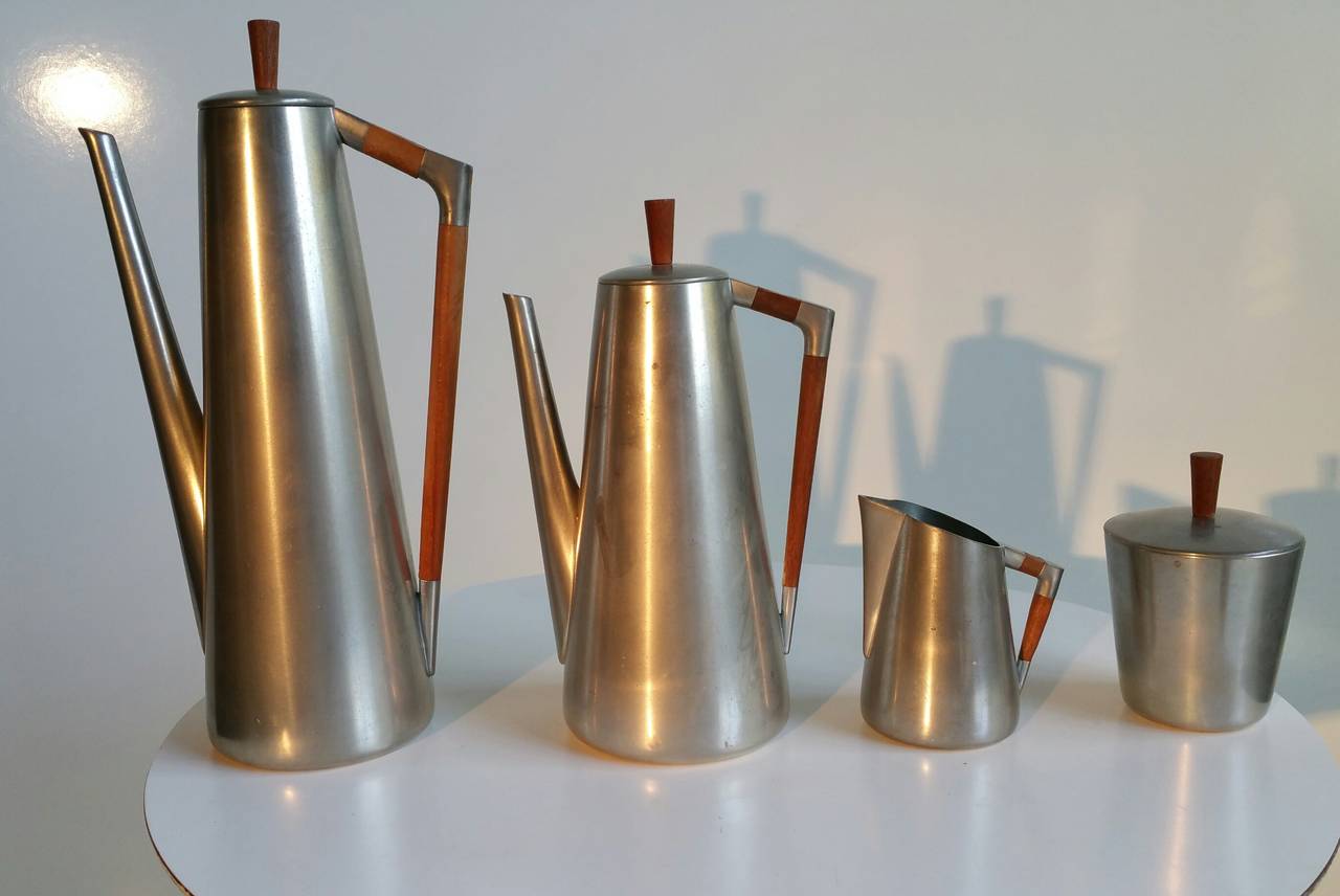 Royal Holland Pewter Coffee or Tea Service Set. Stunning Modernist design, 1960s in excellent original condition.Pewter construction detailed with teak handles and lid knobs.