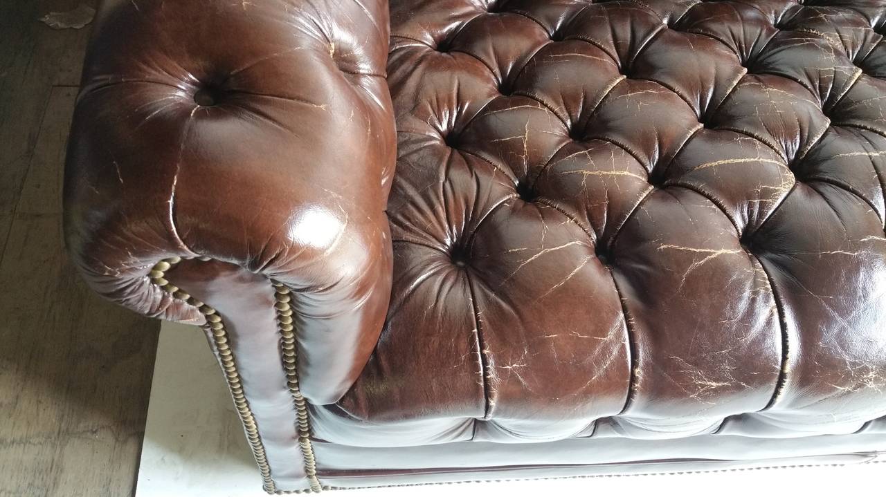 brown leather tufted sofa