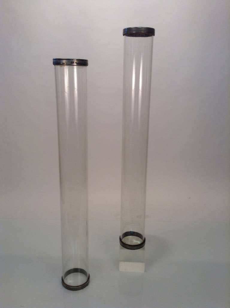 Pair of glass tube cylinders salvaged from old print shop. Wonderful Minimalist design, brass end caps, heavy and thick glass.