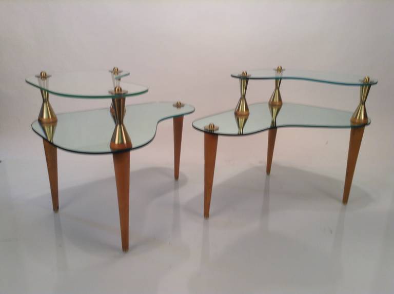 Mid-Century Modern, kidney shape end tables. Elegant design, mirrored, glass, brass supports, wooden legs.
