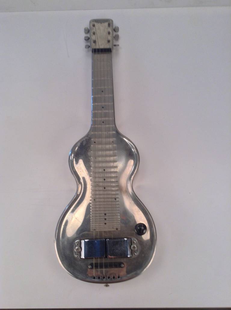 Nice example of Art Deco, Machine Age,1939, Rickenbacker lap steel guitar. Nice original condition. All electronics tested and working perfect. Polished aluminum and steel.