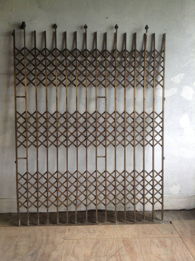 Exceptional, early 20th century brass elevator gate.