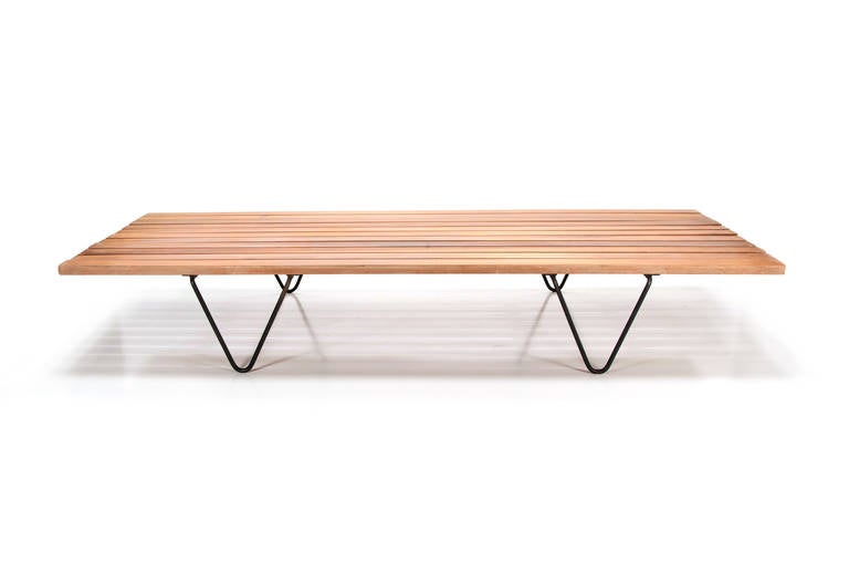 Indoor or outdoor slat-wood bench or daybed in the manner of Bertoia.Elegant. Sleek styling, classic Mid-Century Modern.
