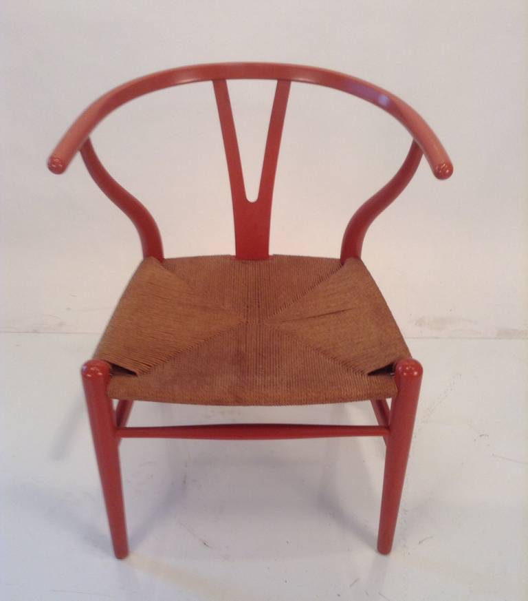 Classic Modernist Wishbone Arm Chair,,designed by Hans Wegner,(also refered to as the Y chair and the CH-24) designed in 1949,,manufactured by Carl Hansen & Sons,, This chair retains original salmon lacquer finish,original burned in label,and