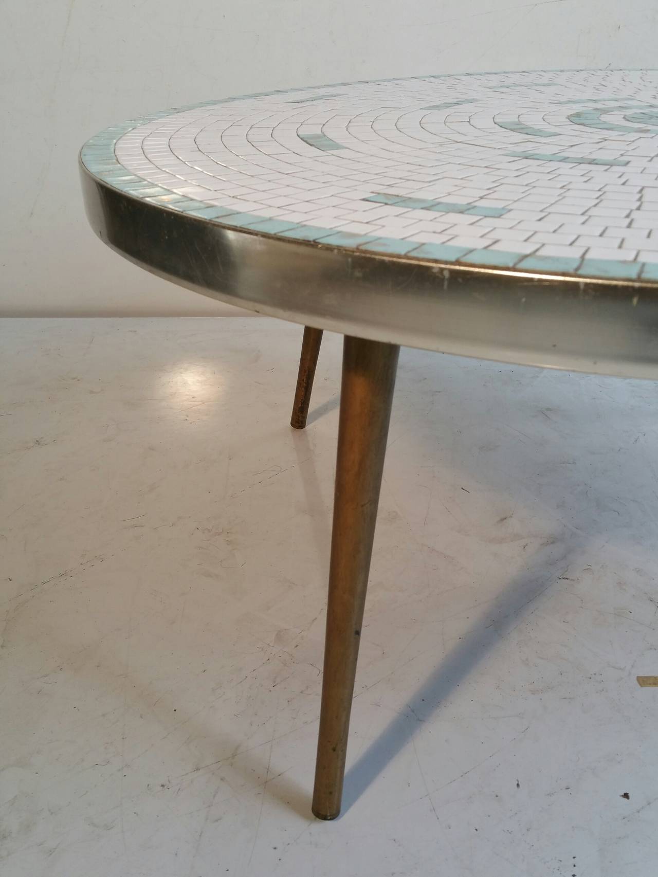 Classic 1950s Tile Top Cocktail Table,, Hohenberg Original..Simple,elegant design,, soothing baby blue and white mossaic tiles with gold accents,,, Painted brass metal legs,,chrome apron,,