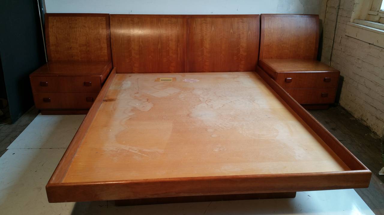 Unusual Custom Platform bed with nightstands...Manufactured by Dunbar,,High style,, Solid cherrywood construction,,Nightstands can be separated and used as slipper chairs with drawers,,