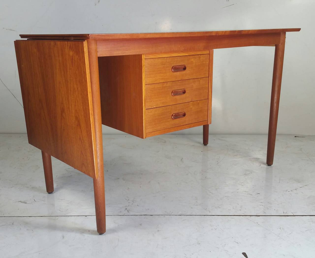 Mid Century Modern Drop Leaf Desk designed  by Arne Vodder made in .Denmark.. Floating hanging drawer cabinet,,adjustable from left to right,, Drop down leaf ,space-saver,Classic modernist quality and design.