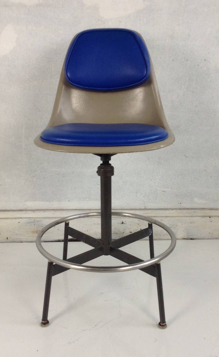 Nice early Drafting stool,designed by Charles and Ray Eames. Swivel padded fiberglass top marked Herman Miller..Adjustable height,