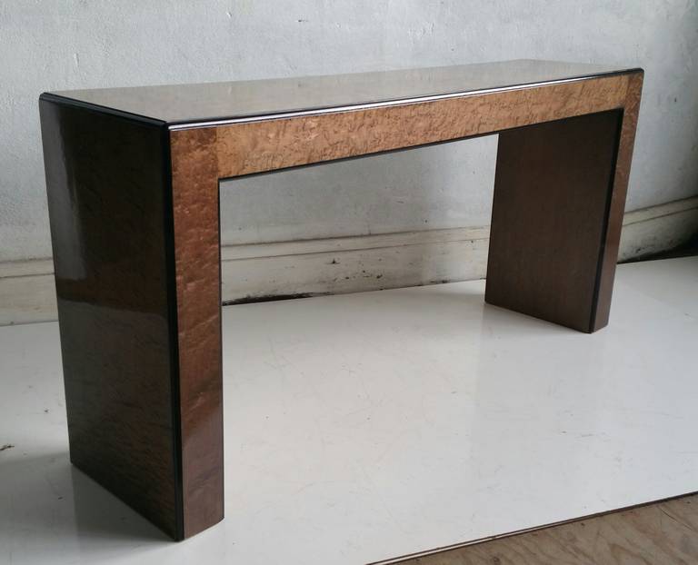 Simple,minimalist console table,, quilted maple and black laquer detailing.Fit seemlessly into any environment..