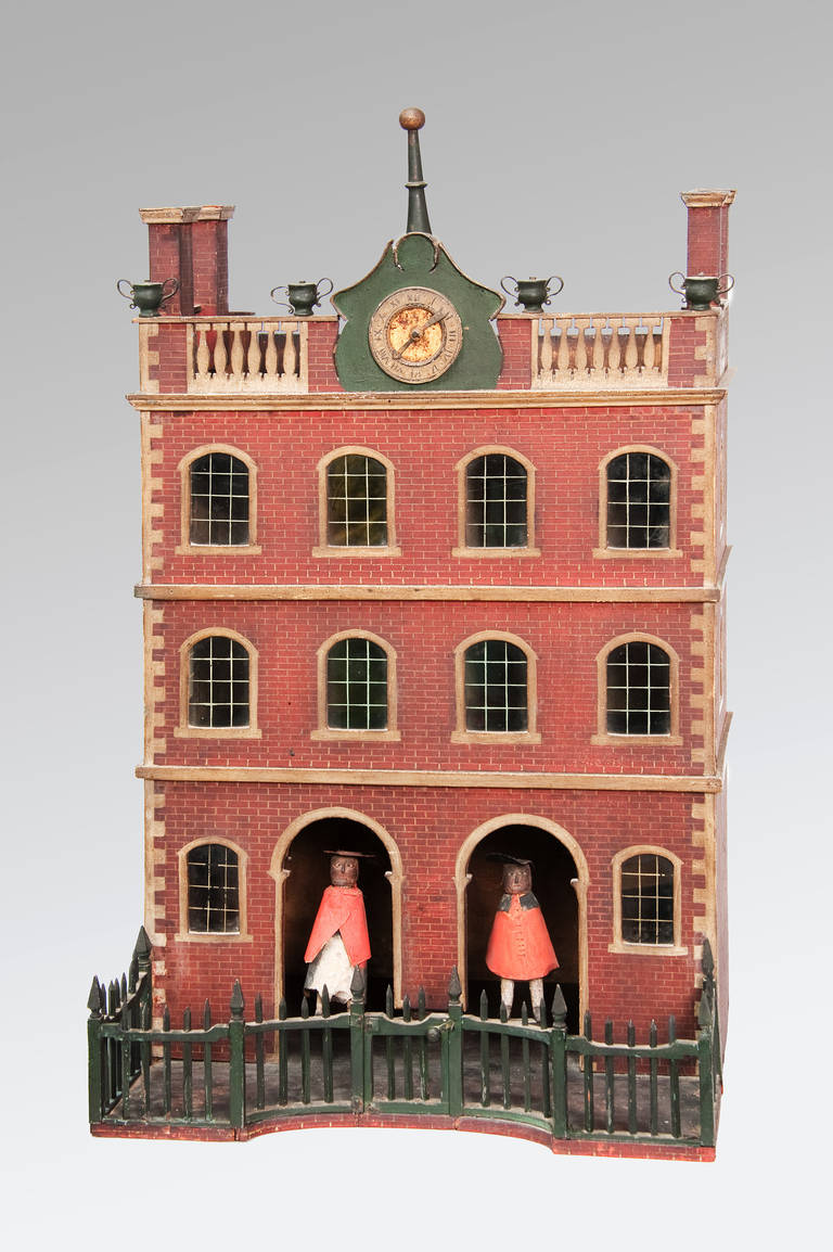 A painted Folk art Federal Period hygrometric architectural Weather-house with tall chimney stacks and a balustraded roof surmounted with urns. The house originating from Massachusetts U.S.A. is in completely untouched original condition has painted