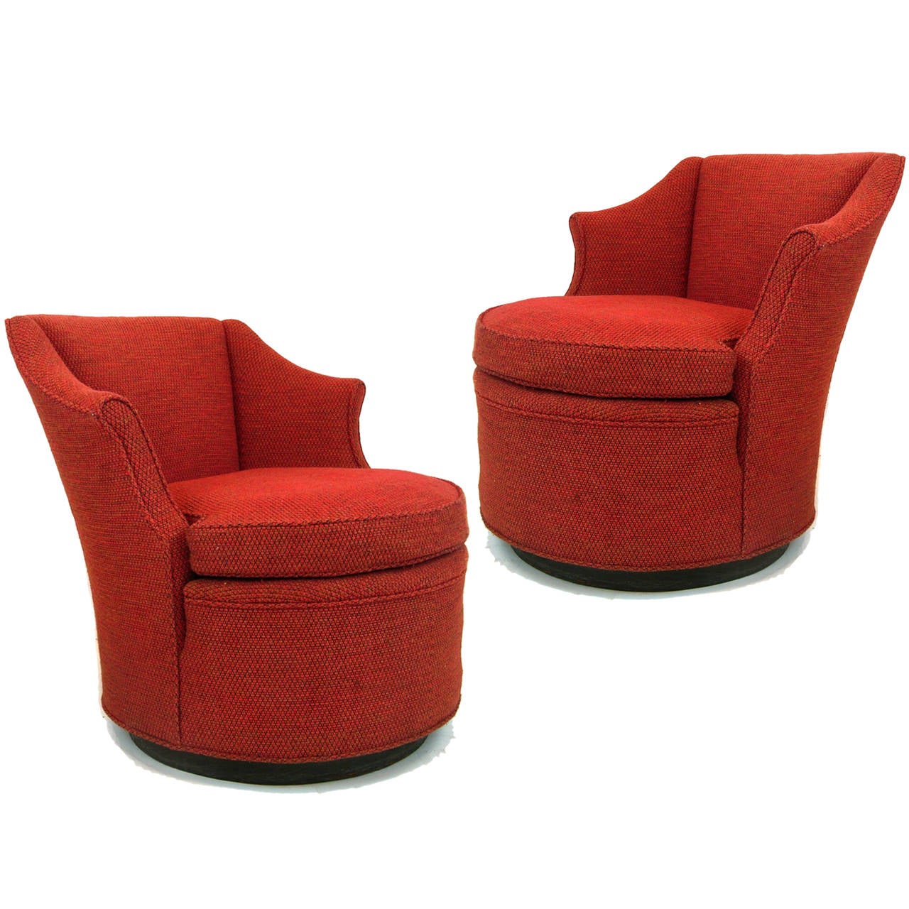 A sleek pair of swivel based chairs. Current upholstery was done in the 1970s. It is a heavy wool red/black weave.