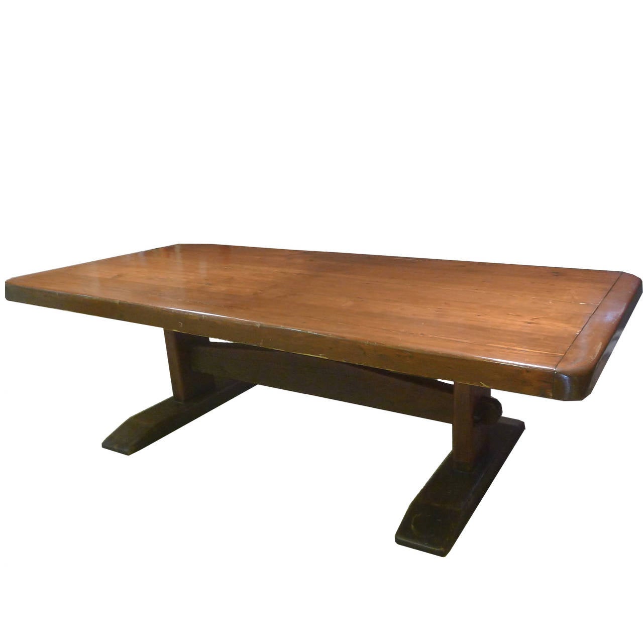 Solid, heavy early American trestle table crafted from solid pine. Shows beautiful age. One deeper surface scratch as shown in photo. Beautiful piece of American history. Measures just under 8 1/2 feet long. Tabletop is 3.5