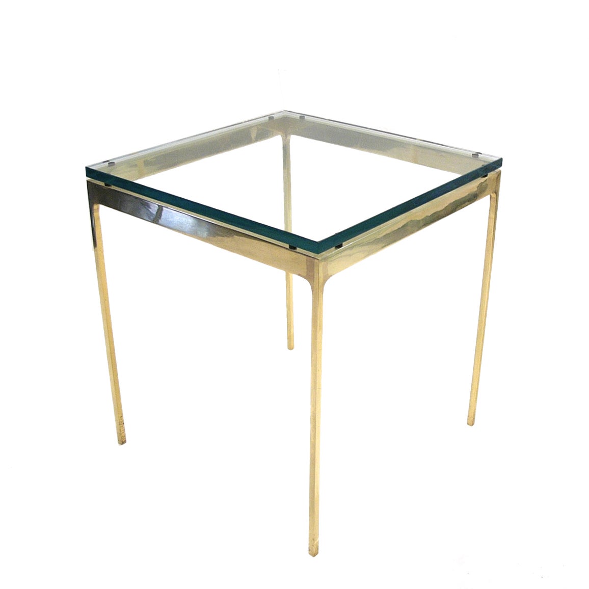 A seamlessly welded brass Nicos Zographos side table from the Thirty-Five series with 3/4 thick glass.