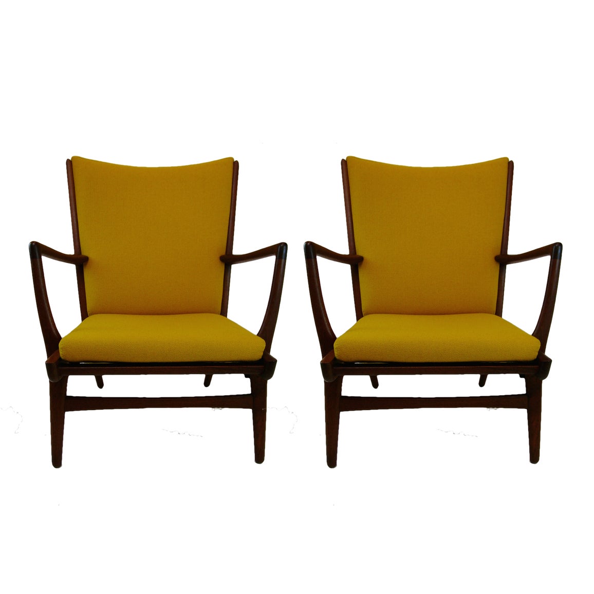 A sculptural pair of Hans Wegner AP16 armchairs in beautiful original condition.