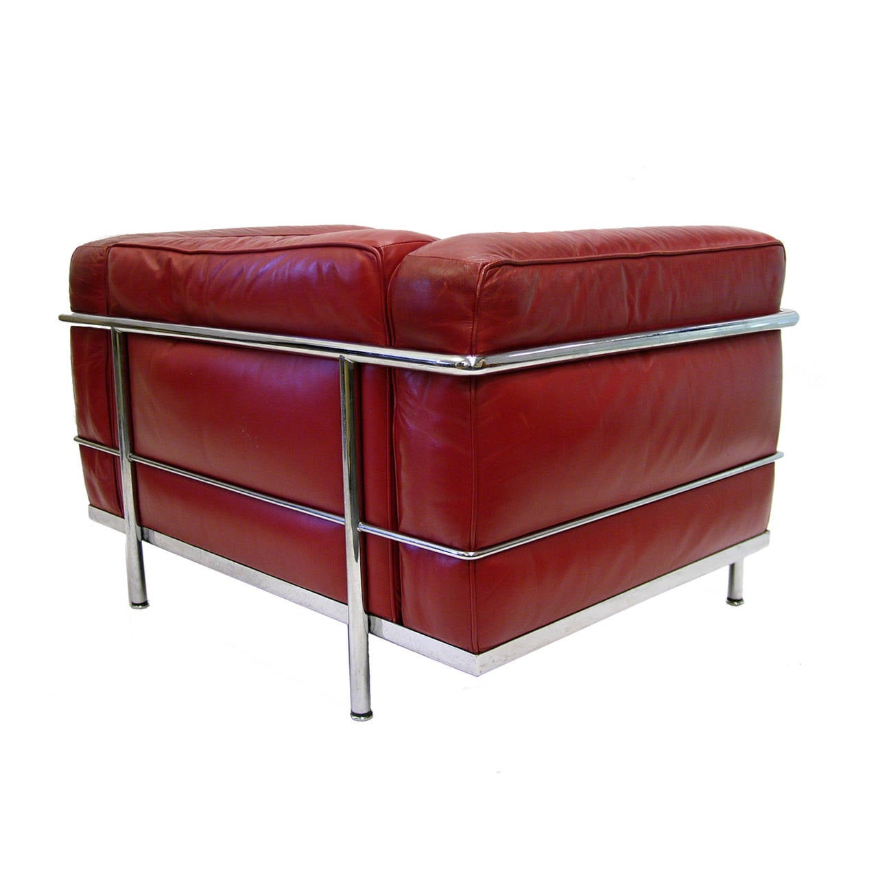 An early pair of Le Corbusier LC3 chairs by Cassina distributed by Atelier in a beautiful patinated red leather. Priced per chair.