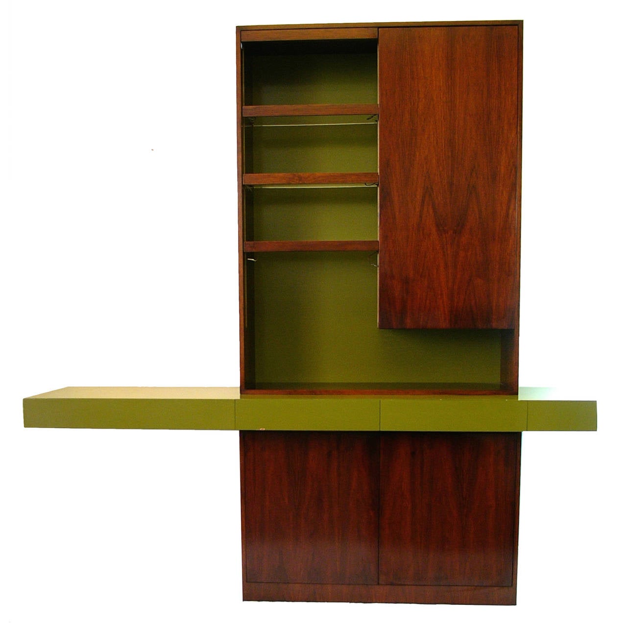 Sideboard or buffet display cabinet designed by Vladimir Kagan. Beautifully stained dark walnut with avocado lacquered detail. Interior drawers are sectioned and felt lined for flatware. Lighted lucite shelving. Stunning sculptural piece