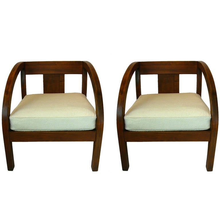 A pair of freshly upholstered stylish chairs by Modernage. Frequently attributed to Paul Frankl .