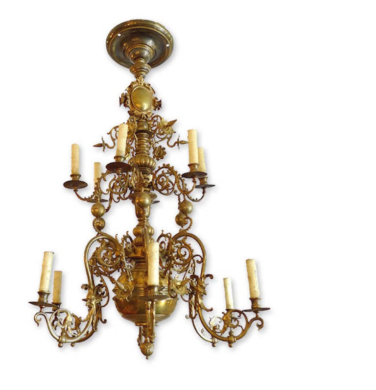 Swedish 19th century two-tier solid brass chandelier with six lights on each tier.