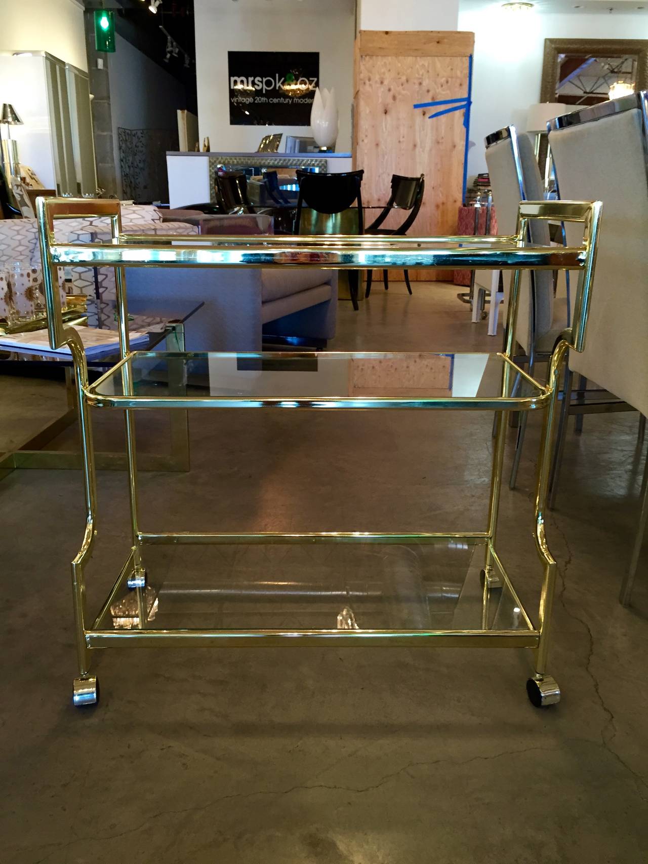 American Hollywood Regency Three-Tier Glass and Gold Tone Metal Bar Cart