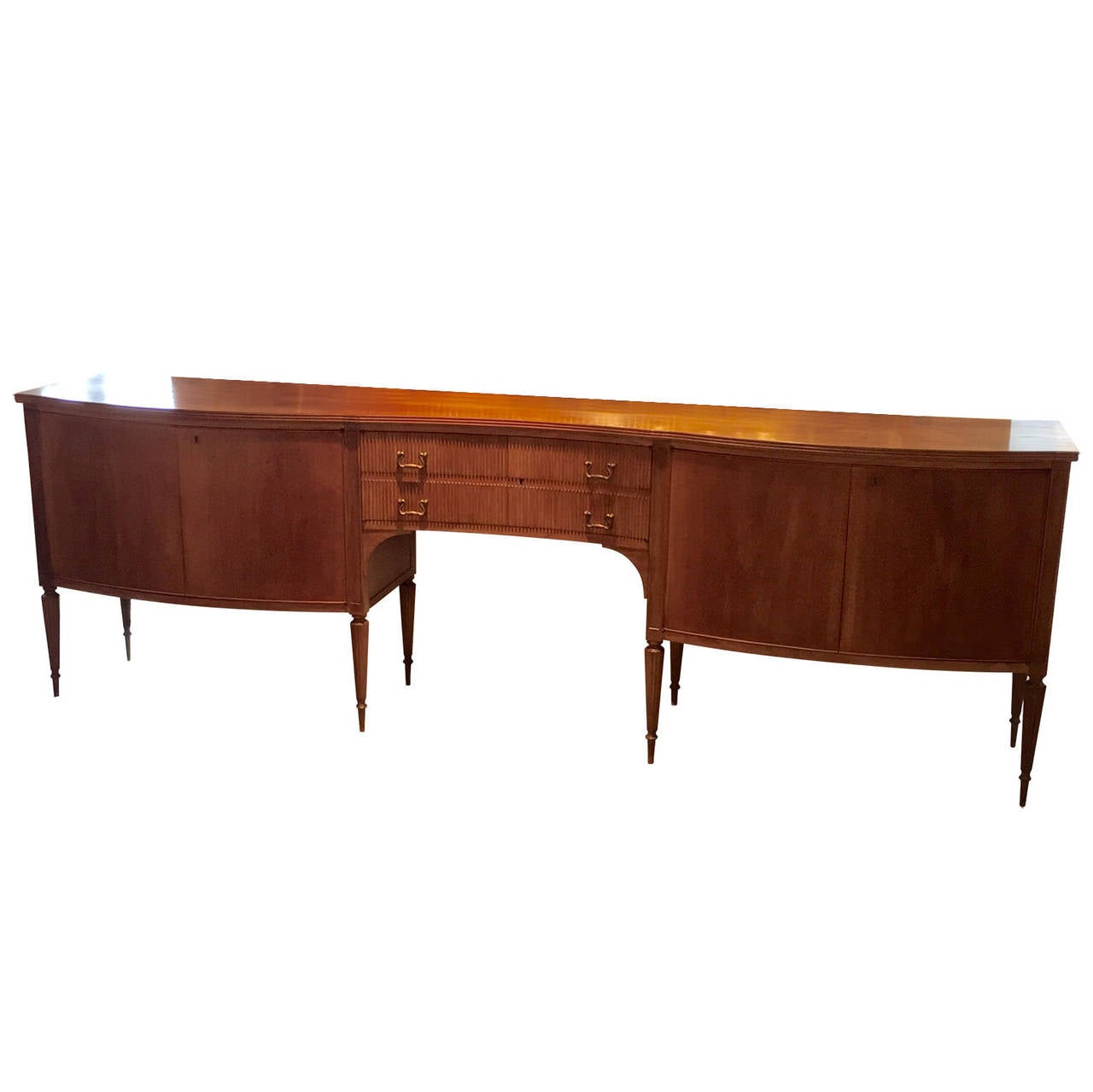 This sideboard is truly representative of MCM Italian design with its seductive curves, grounded in the efficient use of materials and intelligent manufacturing. In examining pieces designed by Milanese architect and designer Paola Buffa, one is