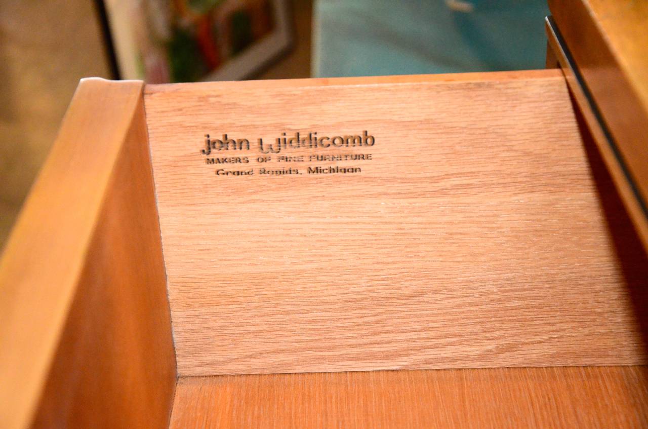 John Widdicomb started his namesake company in 1897. John L. Stuart became the major stockholder and chairman of the board in 1939.  Widdicomb manufactured primarily European reproduction bedroom suites during the 1940s-60s. In the1970s, Widdicomb