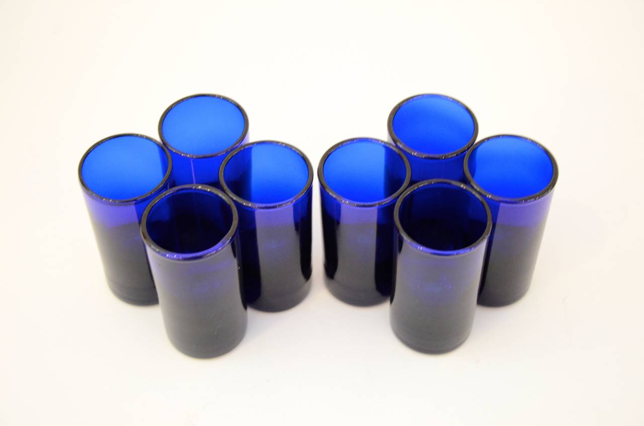 Offered are a set of eight vintage cobalt blue French shot/ vodka/ tequila glasses. The color of this blue is simply stunning and the shape and thickness of the glass perfect for a shot of Paltron, Chopin or any of your favorite libations. This set