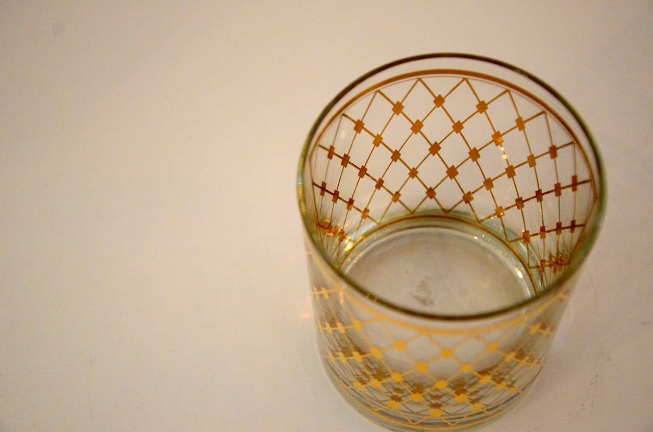 Featuring two panels of bright gold Harlequin or Fishnet pattern decoration. Signed by the artist.