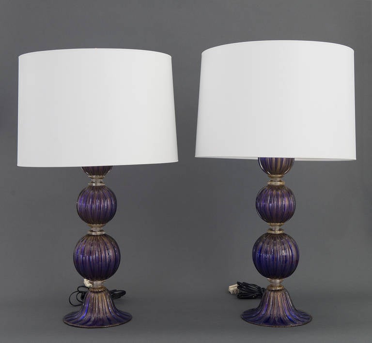 Offered are a pair of monumental lapis blue Murano glass table lamps by Barovier e Toso. Barovier e Toso is a Venetian company with a vocation and culture that is international, creating solutions of decorative lighting in Murano glass, all