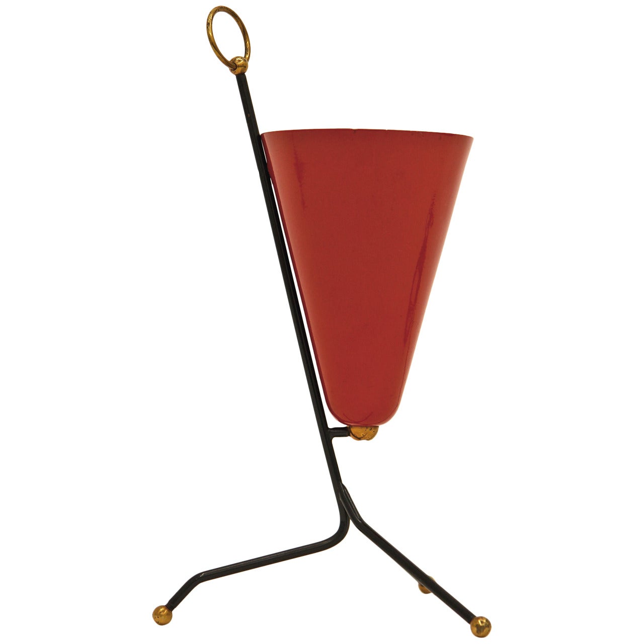 Cute Italian table lamp from the 1950s with a red lacquered cone shade mounted on a black lacquered tripod structure with brass details. At the top of this up light table lamp is a finial in the form of a brass ring. Very nice original condition