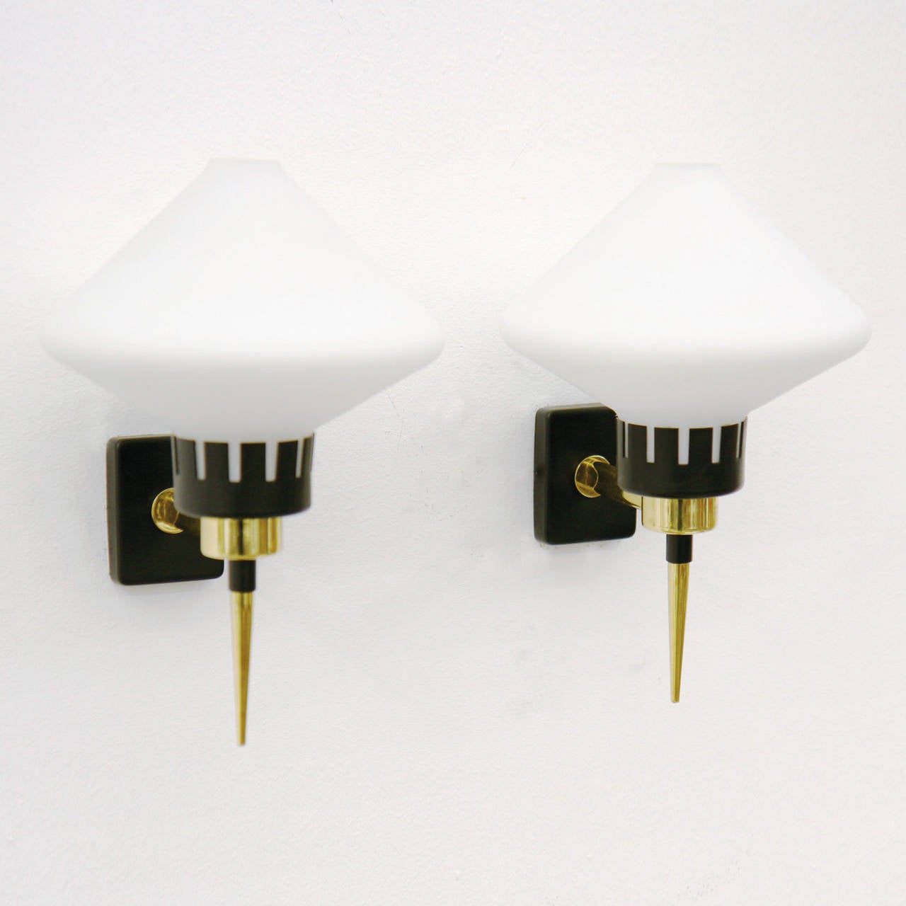 Elegant pair of Italian mid century torch-style sconces. Satinated glass on lacquered aluminum and brass. One E14 socket per item with new wiring.