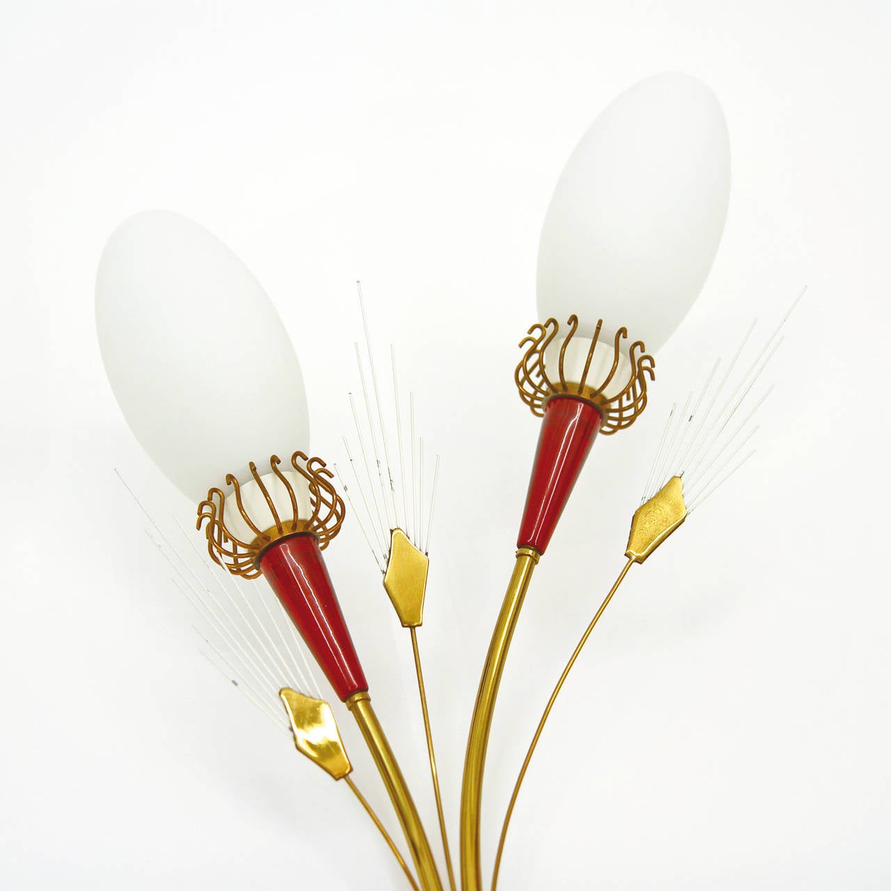 Delightful 1950s French Modern wall lights by Lunel in the shape of a flower bouquet. Brass hardware with ruby colored Lucite and frosted glass shades. Very good vintage condition with some loss of paint on the lacquered 