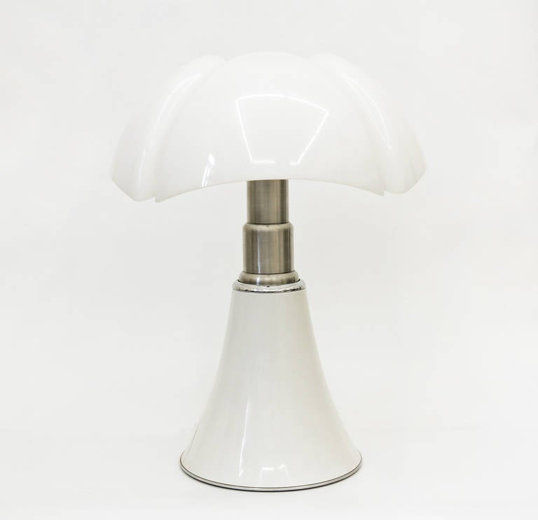 Iconic design of the 60's. Gae Aulenti designed this lamp in 1965 for Martinelli Luce. The telescopic stainless steel 
