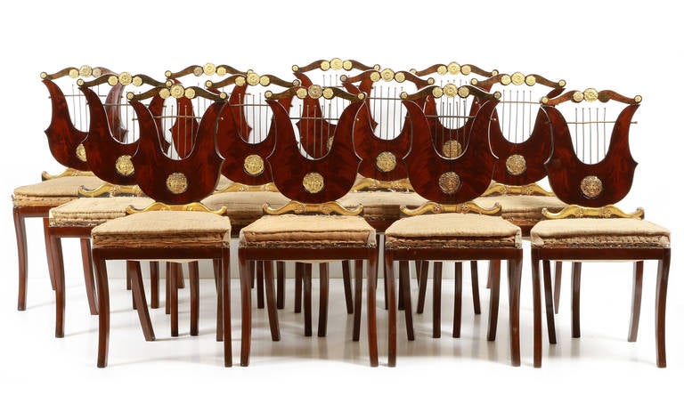 A set of 12 chairs, mahogany wood and hardware.