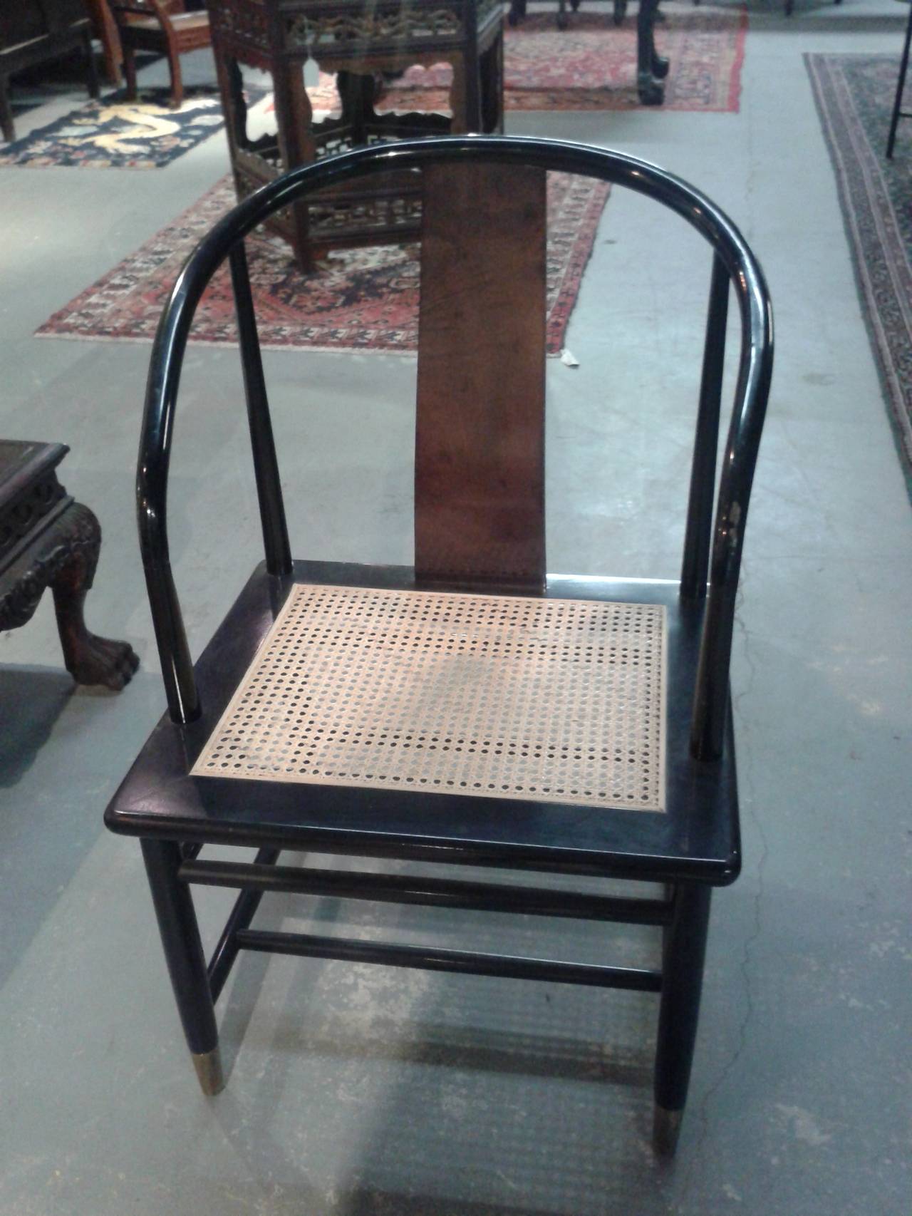 Black Mid-Century Cane Bottom Horseshoe Style Brass Foot Chair In Excellent Condition For Sale In Birmingham, AL