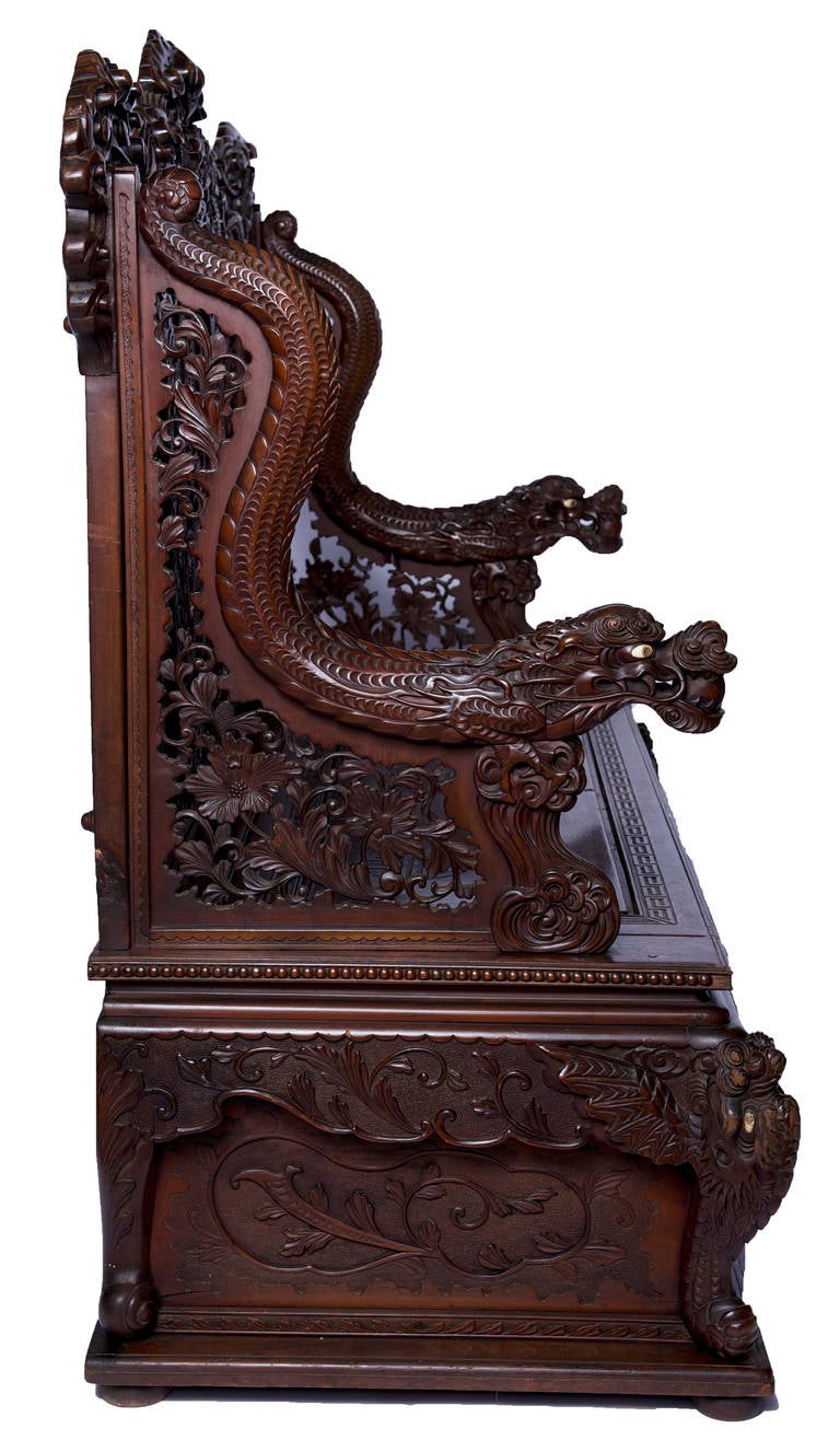 Japanese Elaborately Carved Rosewood Bench Seat Meiji Period Stunning Condition, 3 panel carvings of phoenix birds rising with dragon carvings on top of the bench.  Each dragon and phoenix is finished beautifully with eyeballs in ivory and black