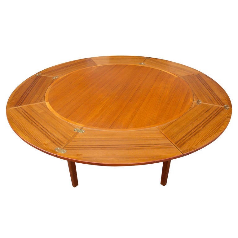 Great Danish teak round ''Flip Flap'' dining table with unique system for circular expansion. Signed on bottom: Dyrlund Denmark