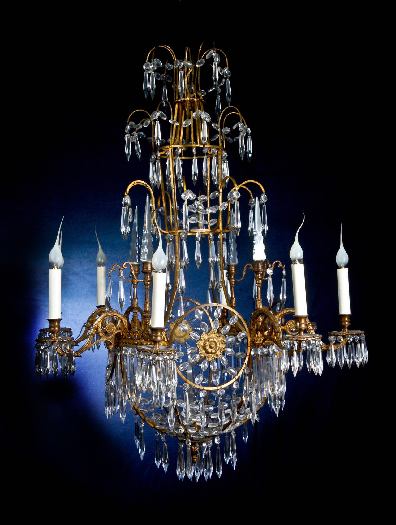 A Fine Antique Russian Neoclassical Gilt Bronze & Cut Crystal Multi light chandelier embellished with cut crystal chains and prisms.
