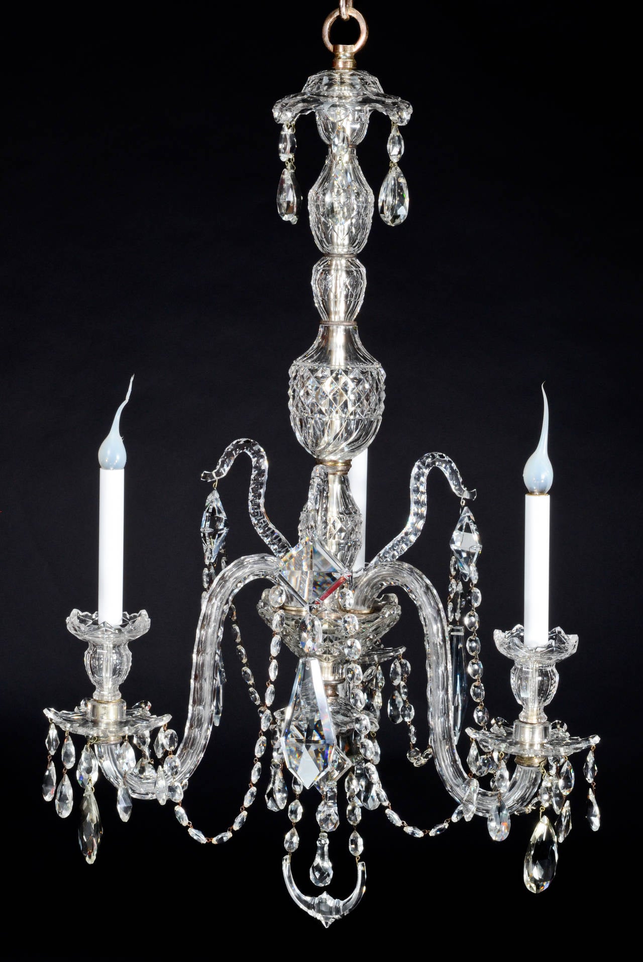 A Pair of Fine Antique English George III Cut Crystal three light chandeliers of superb quality embellished with cut crystal prisms and chains.