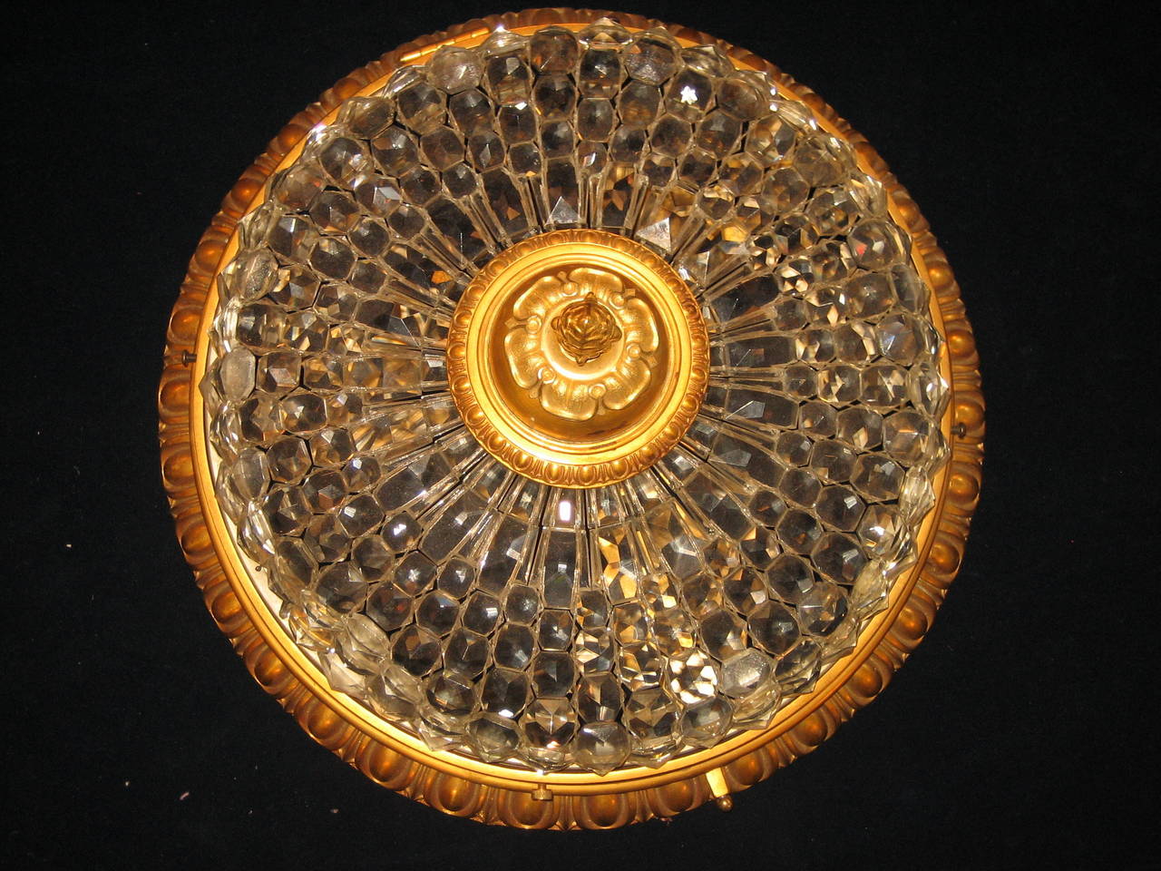 A fine and unique antique French Louis XVI gilt bronze and cut crystal ceiling fixture.