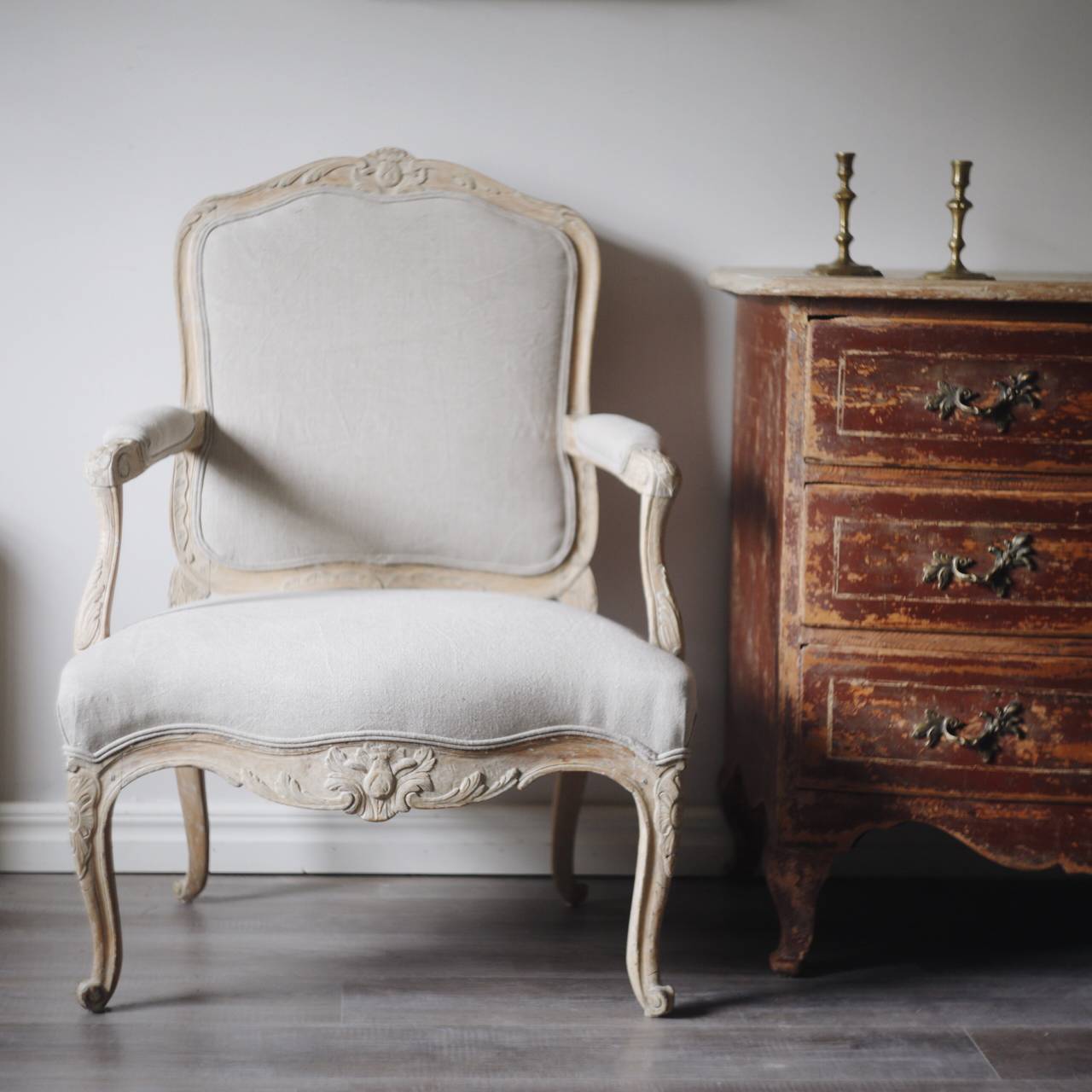 Fine 18th century Swedish rococo armchair in original color and upholstered in a grey linen.