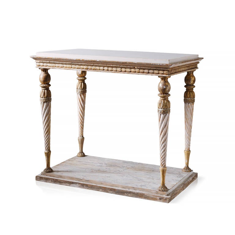 Fine Swedish Gustavian console table with Carrara marble top, Stockholm, circa 1810. Original paint and giltwood. It fit's great in the middle of the room and against a wall as it's a center table, carved on all four sides.
