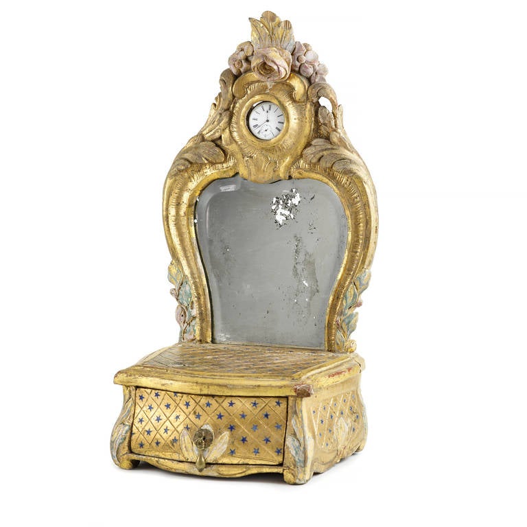 Richly carved 18th Century Swedish Rococo dressing Mirror with one drawer and compartment for pocket watch.
