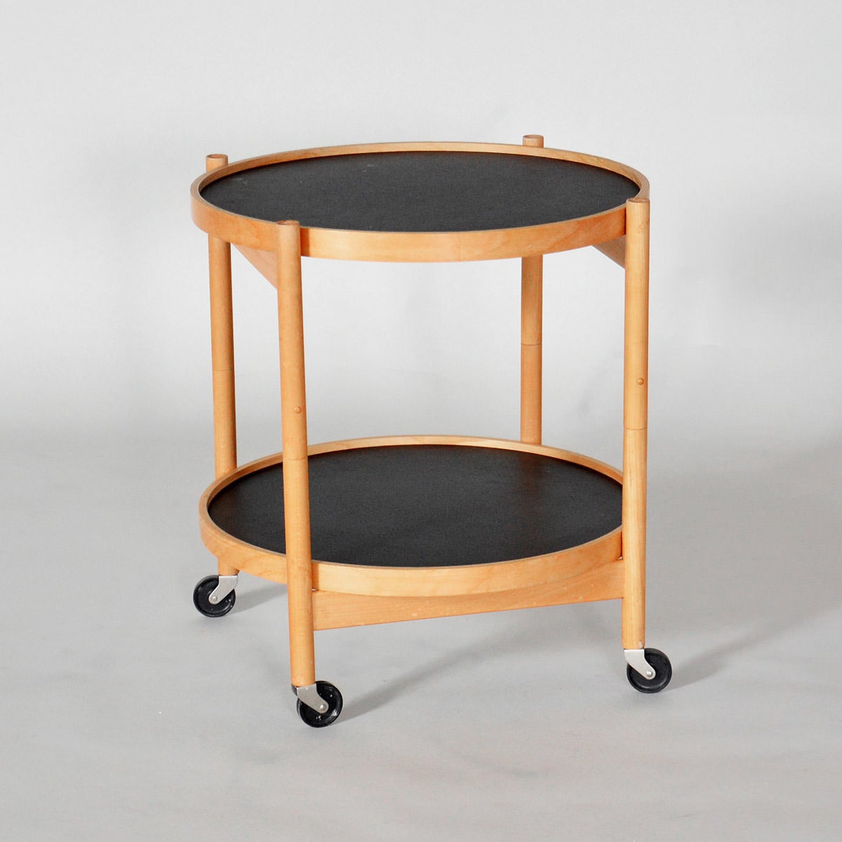 Tray table in beech wood. Foldable frame with two loose turnable plates in black/white laminate.

We ship this item world wide, please write to contact@apetersen.dk for shipping options and prices.