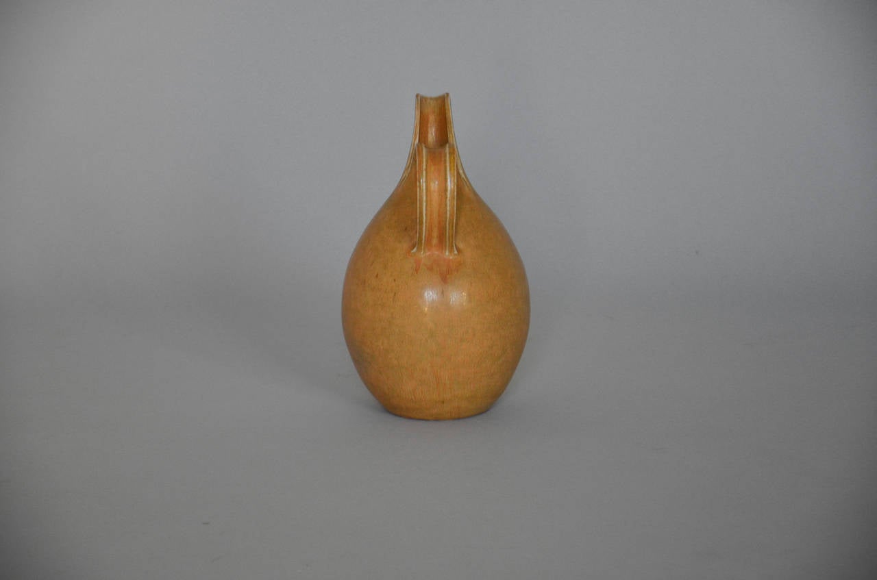 Split pitcher in stoneware decorated with orange/yellow hare’s fur glaze. Stamped Saxbo, Denmark.